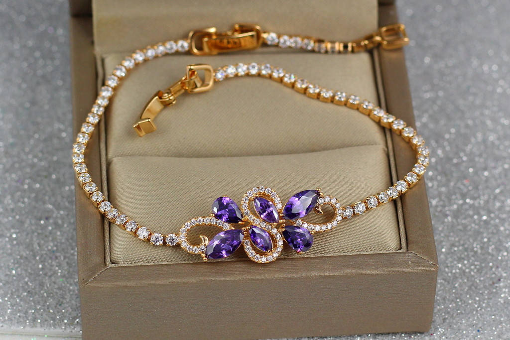 

Браслет Xuping Jewelry переплетение с фиолетовыми камнями 18,5 см 3 мм золотистый