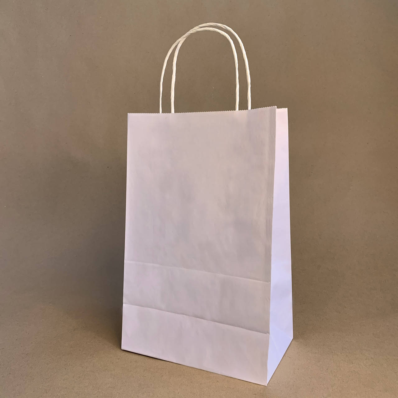 

Пакет бумажный крафт белый с ручками 220х120х290