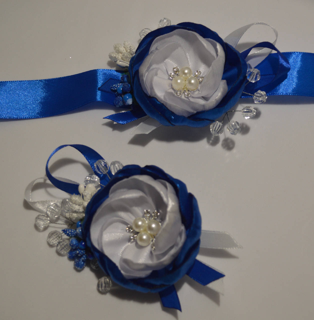 

Набір бутоньєрок для свідків, Піон Синій