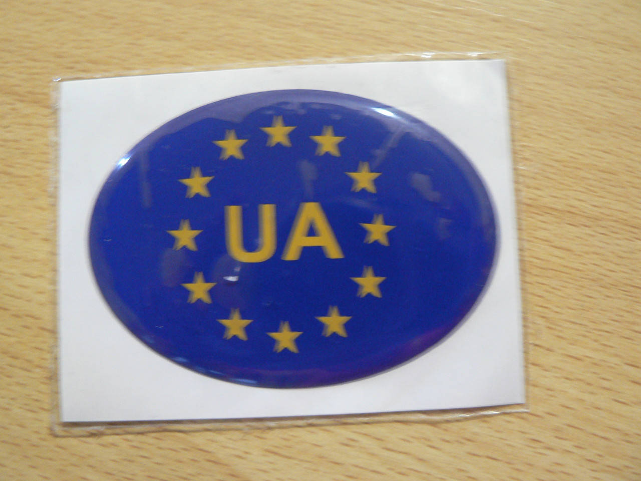 

Наклейка s силиконовая UA Евросоюз Украина 72х52х1.3мм синяя овал на авто, Синий