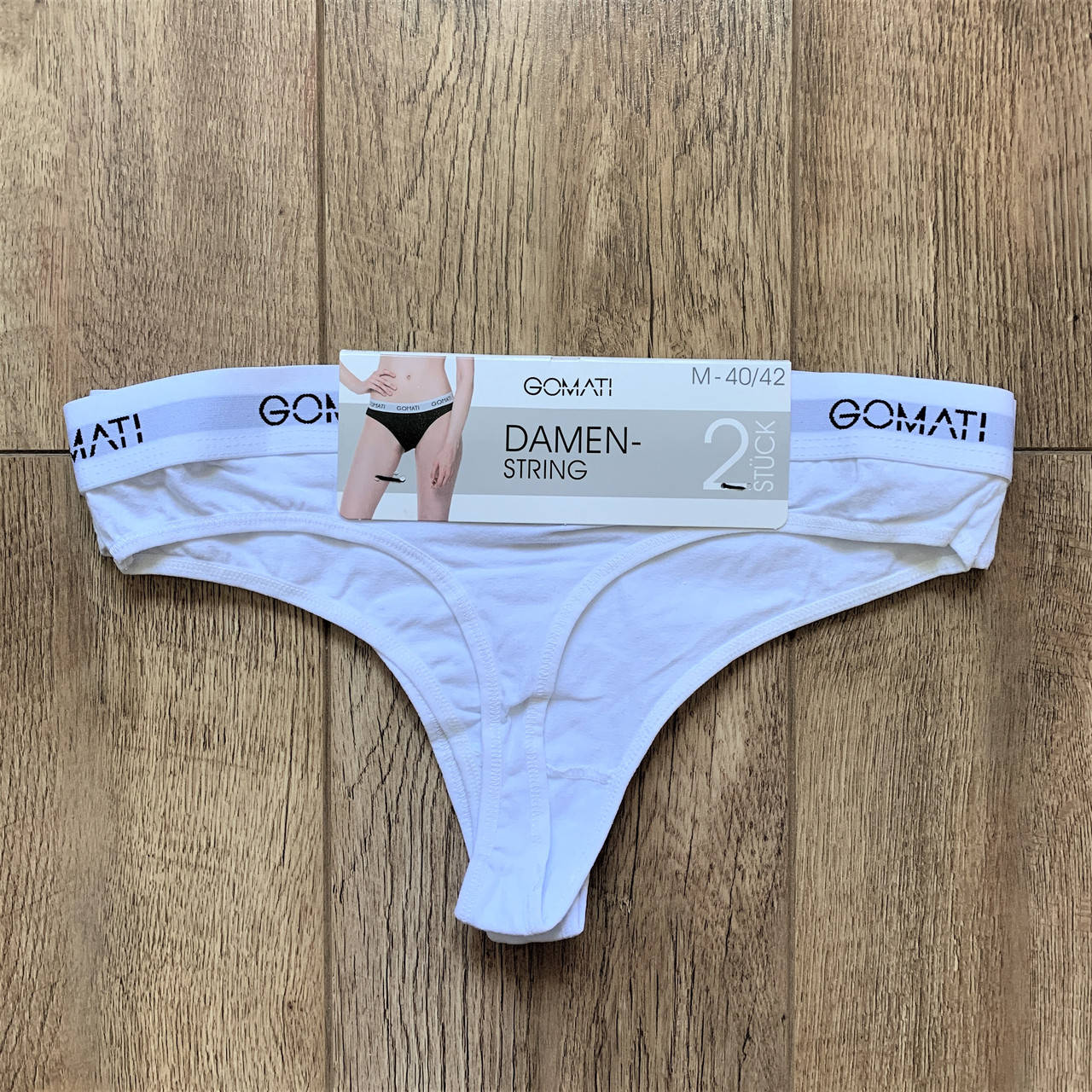 

Набор женских трусов "Gomati" стринги. Размер: M. (2 шт/уп). Белые. Турция., Белый