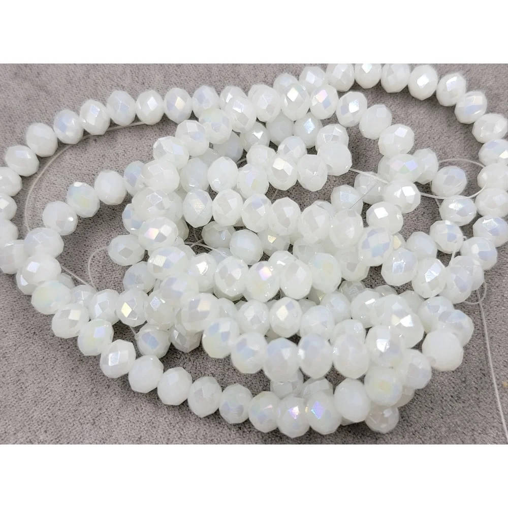 

Бусины хрустальные (Рондель) 6*4 мм пачка 90-95 шт, цвет - белый с переливом матово-прозрачный