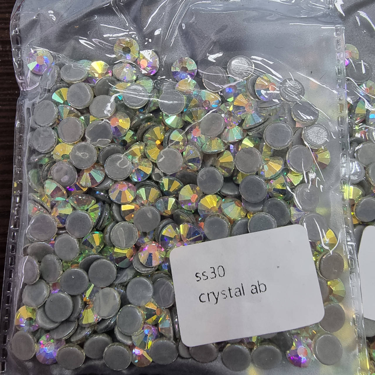

Термо-стразы ss30 Crystal АВ (хамелеон)280шт. (5.6мм) "Crystal Premium" отходит клей