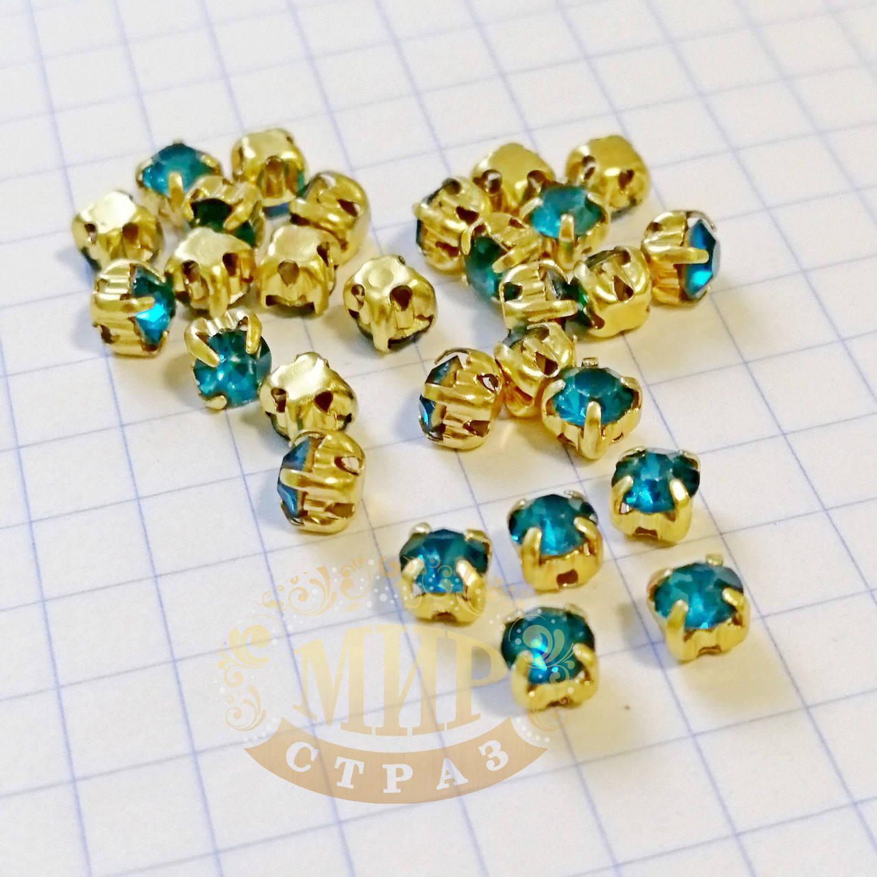 

Круглые стразы чатоны в золотых цапах, размер 4мм, цвет Blue Zircon, 1шт