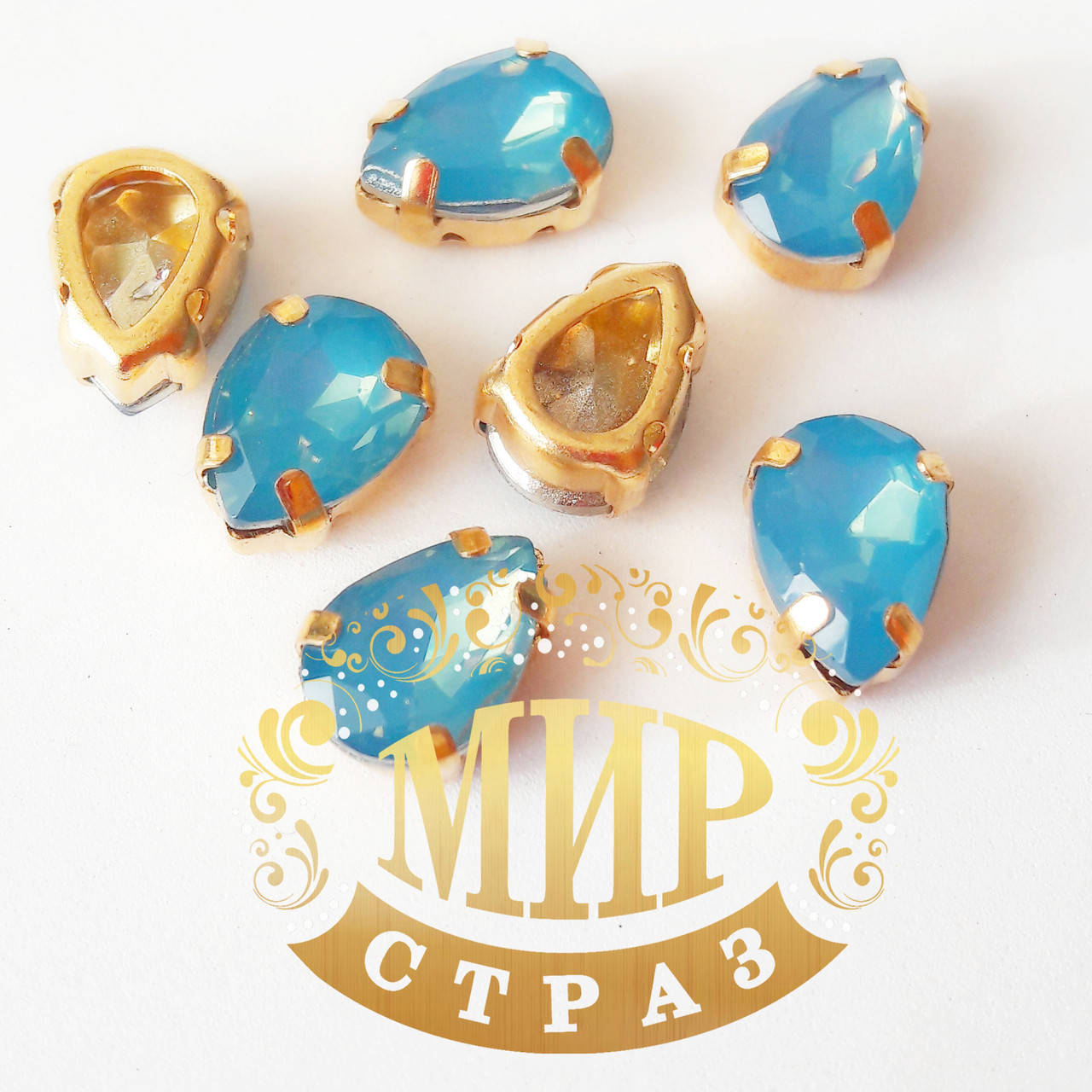 

Опаловые капли 7x10, в улучшенных золотых цапах, цвет Lt Sapphire Opal