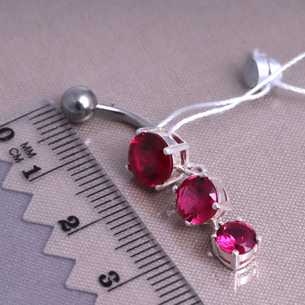 

Пирсинг в пупок с ярко-розовыми цирконием. Серебро 925°.