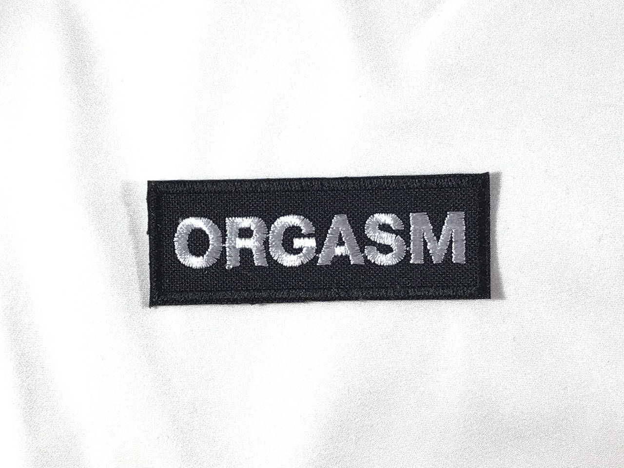 

Нашивка ORGASM надпись 70х25 мм, Разные цвета