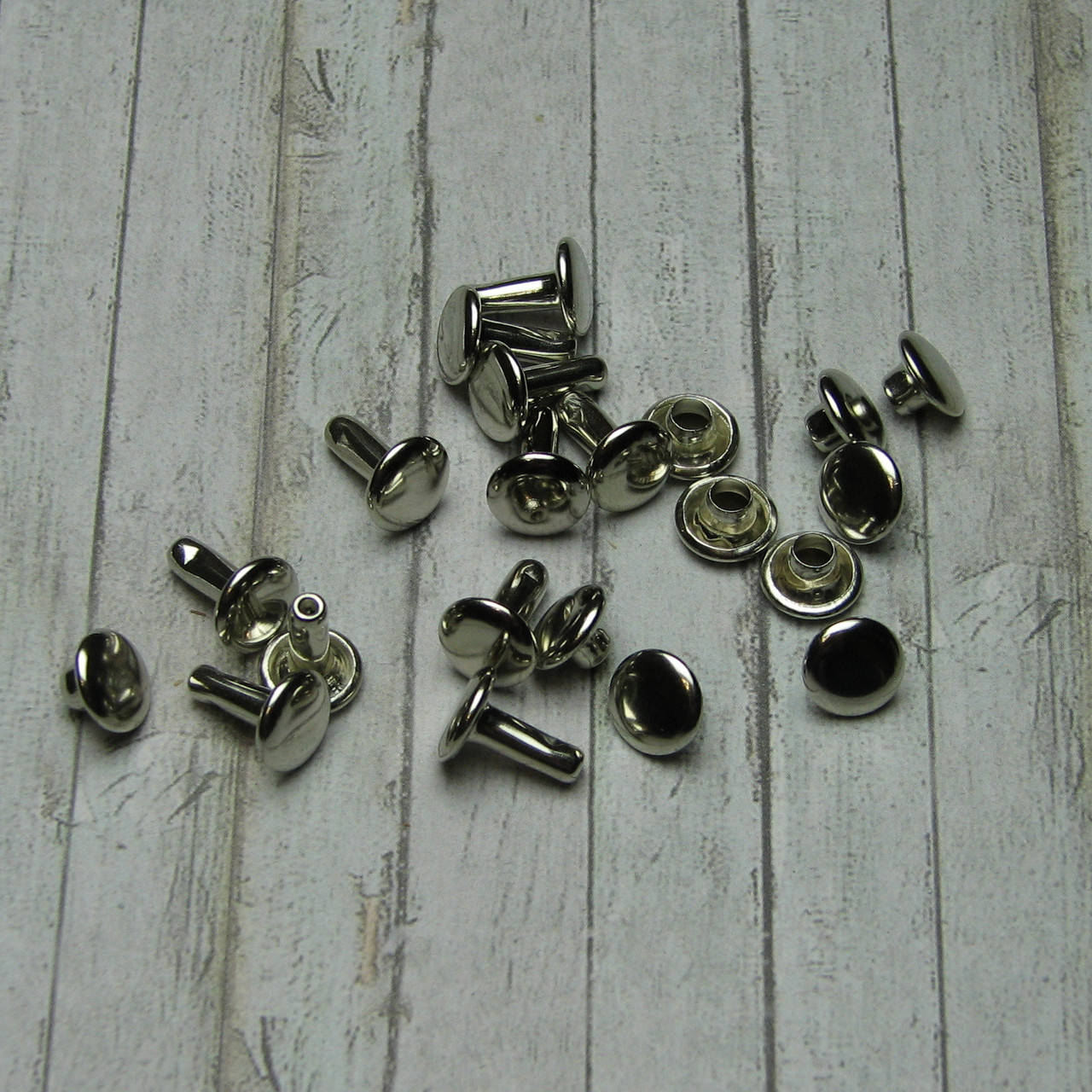 

Хольнитены двусторонние для кожи Заклепки серебро 8*10мм 10шт(FHL004)