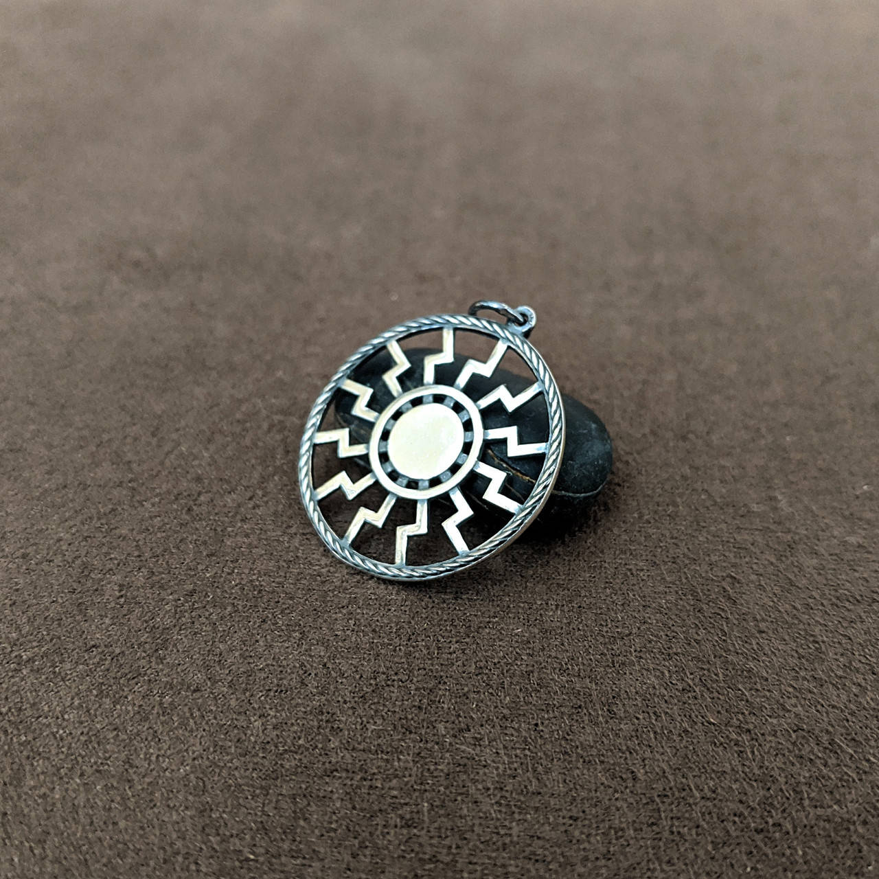 

Серебряный славянский оберег "Черное солнце"