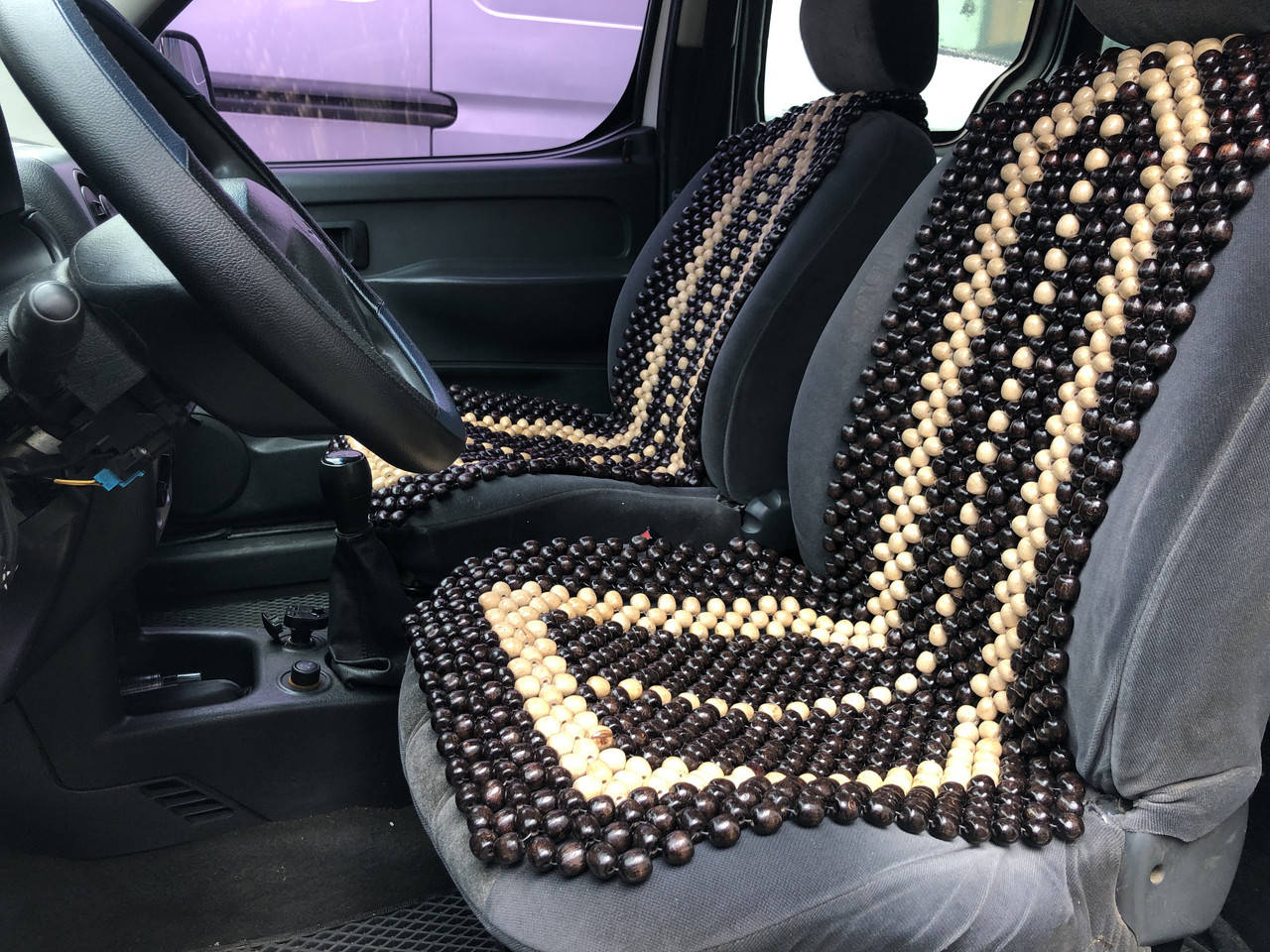 

Деревянная автомассажная накидка на сиденье автомобиля.