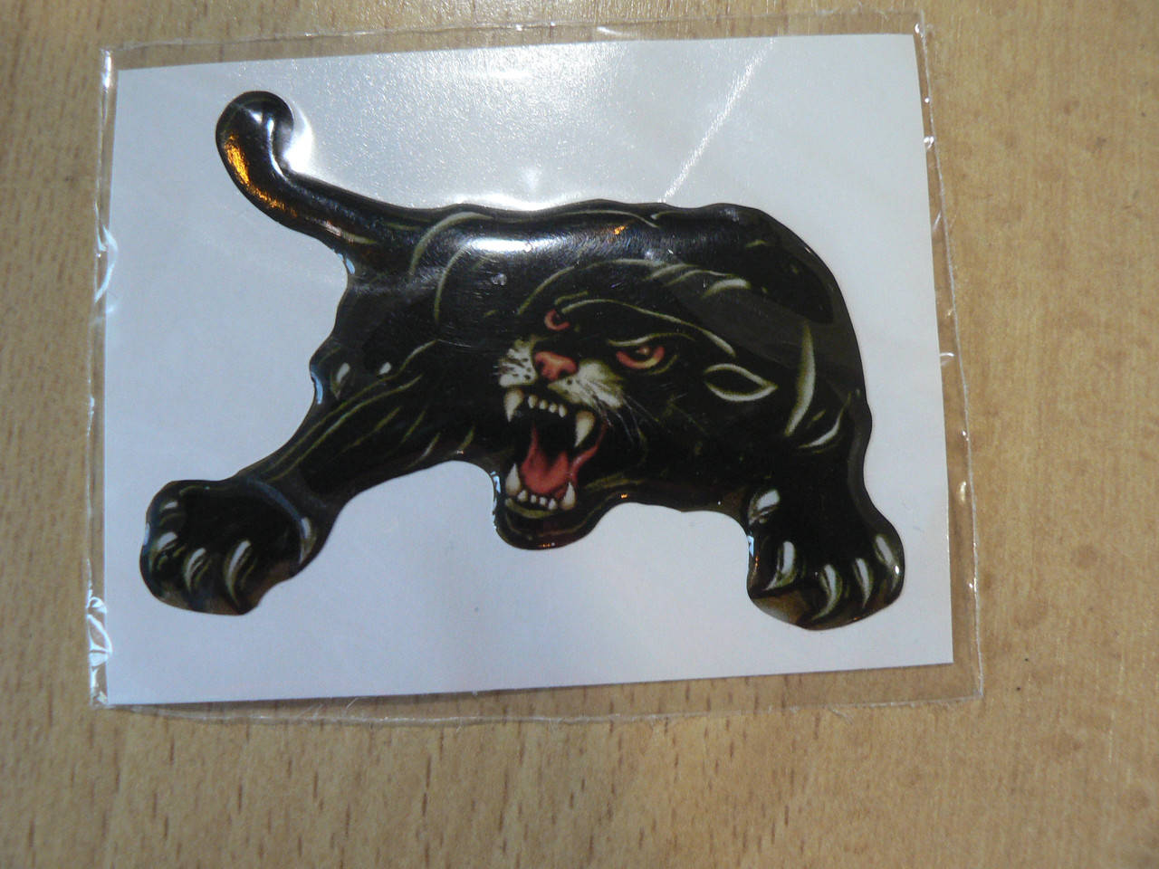 

Наклейка s силиконовая Пантера 75х58мм №2 хвост слева черная с красными глазами пума кот в на авто