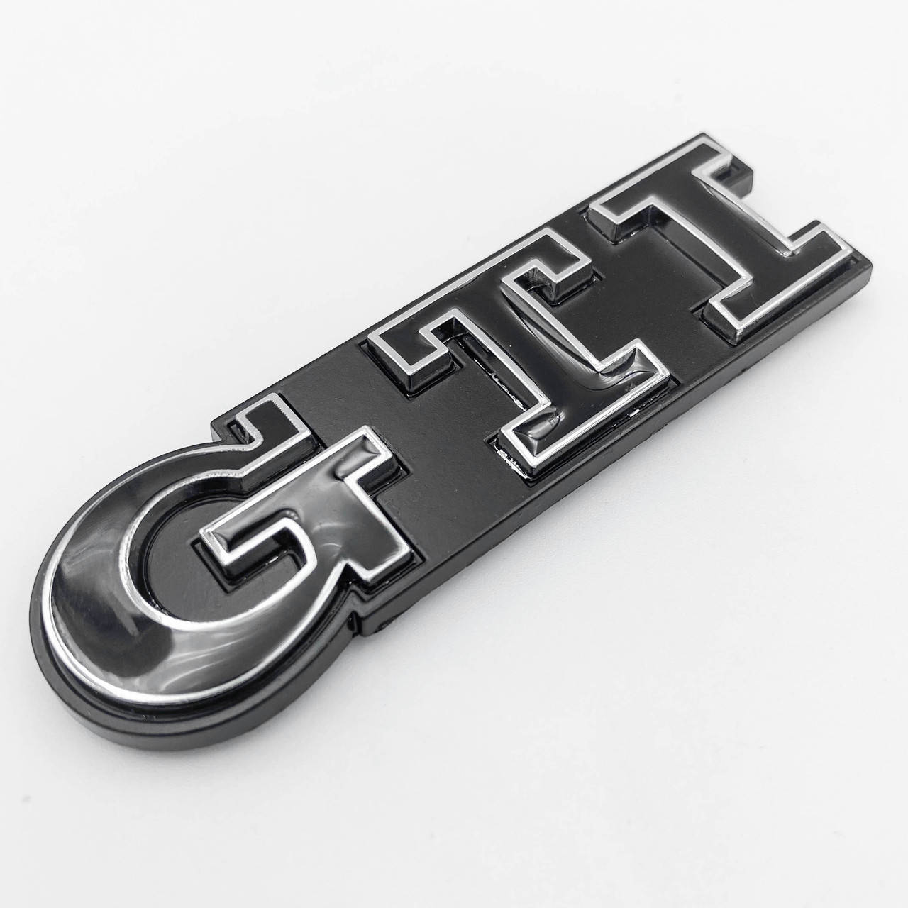 

Эмблема перед, значок решетки радиатора GTI VW (Фольцваген) 93x26 мм Черный хром ободок