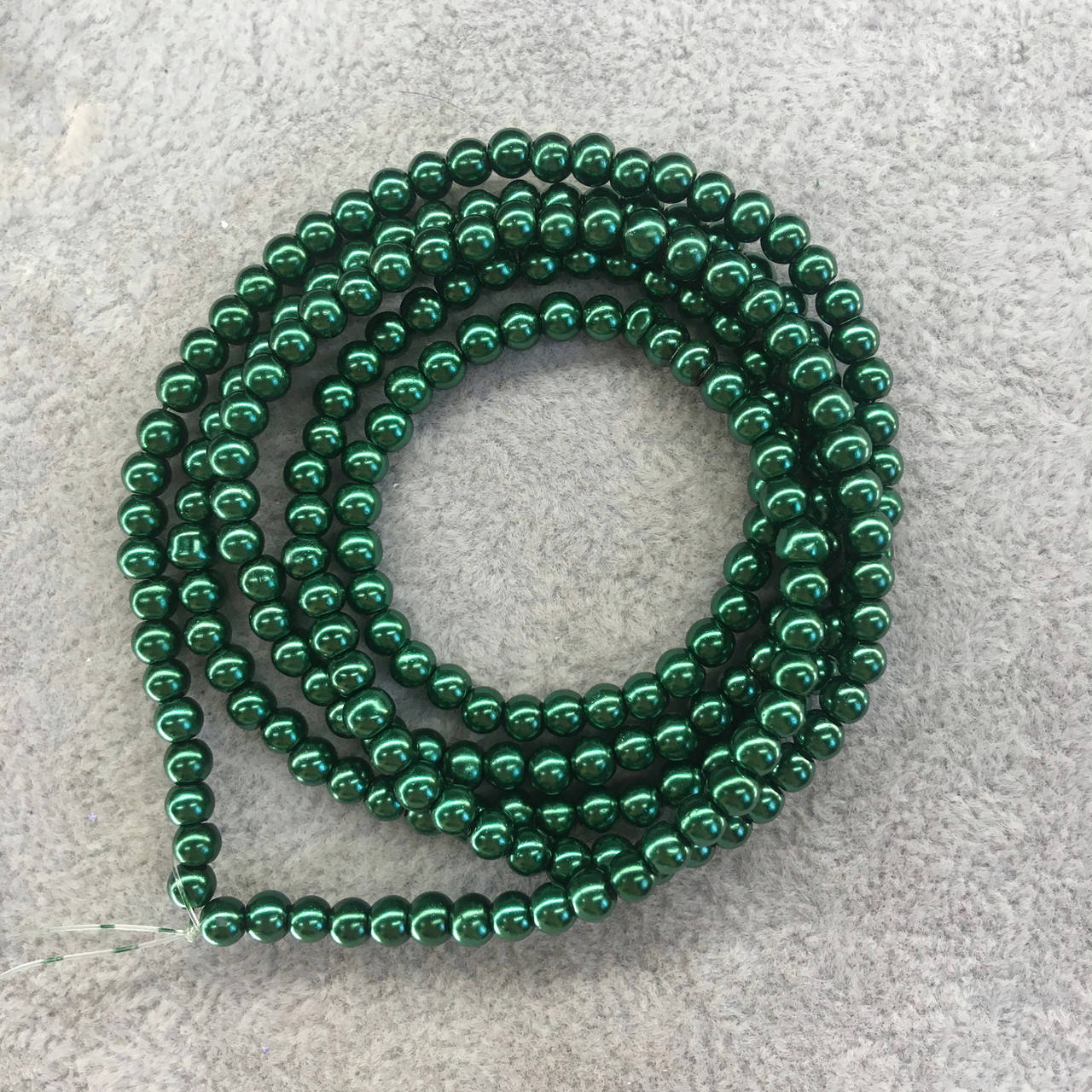 

Бусины на нитке Майорка цвет зеленый (стекло) d=4мм L=80см (~200 штук)