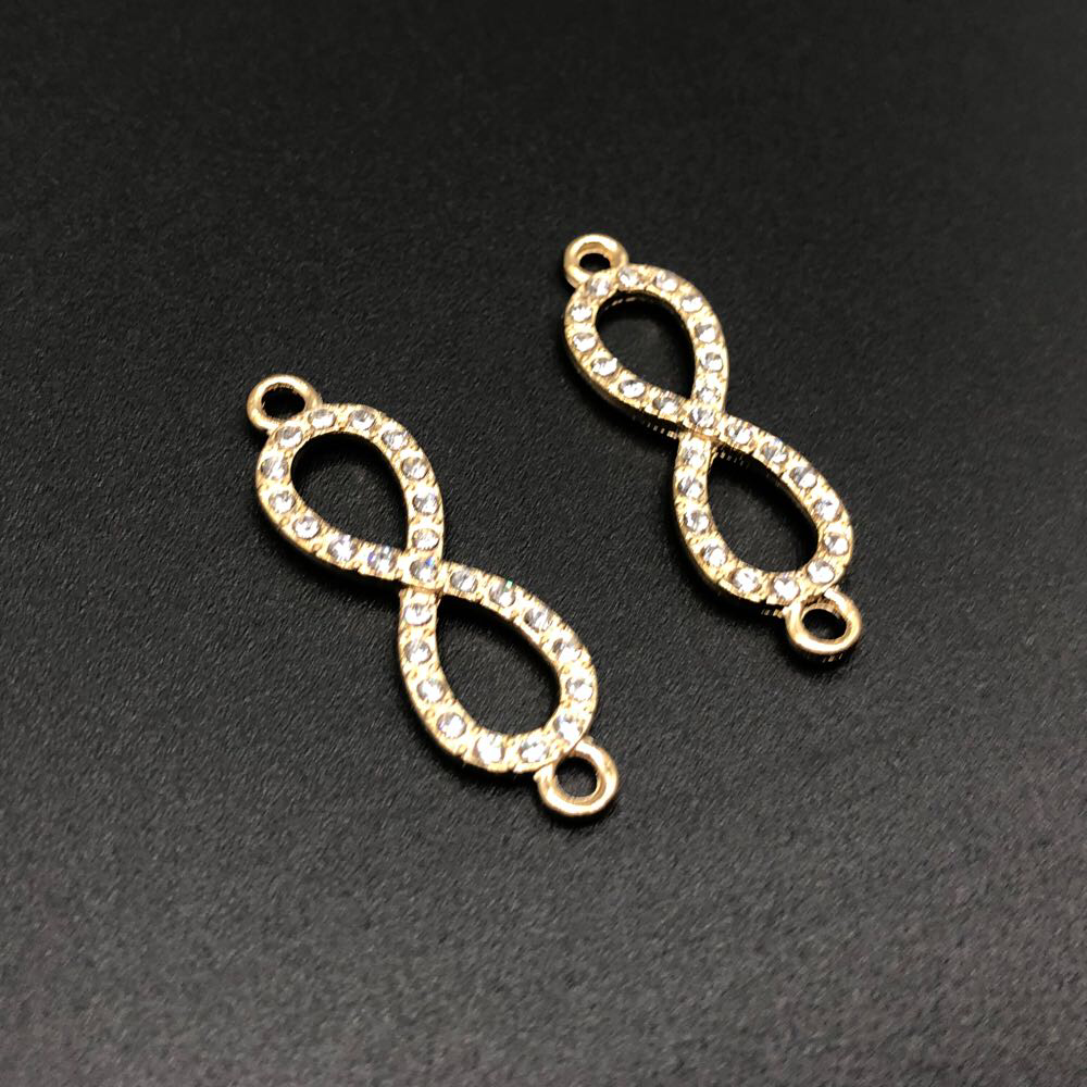 

Бесконечность. Цвет золото. С камушком. 33мм