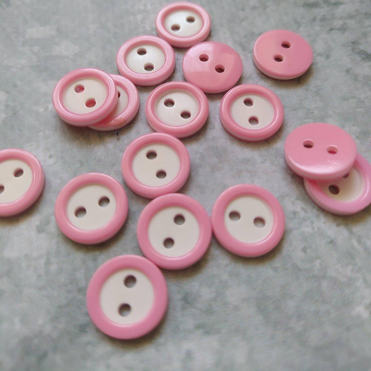 

Пуговичка пластикова з обідком 11 мм (світло рожева)