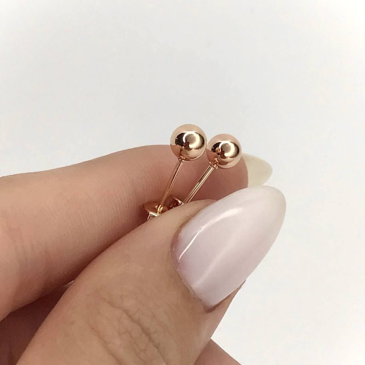 

Серьги-гвоздики Шарики покрытие розовым золотом 18к.