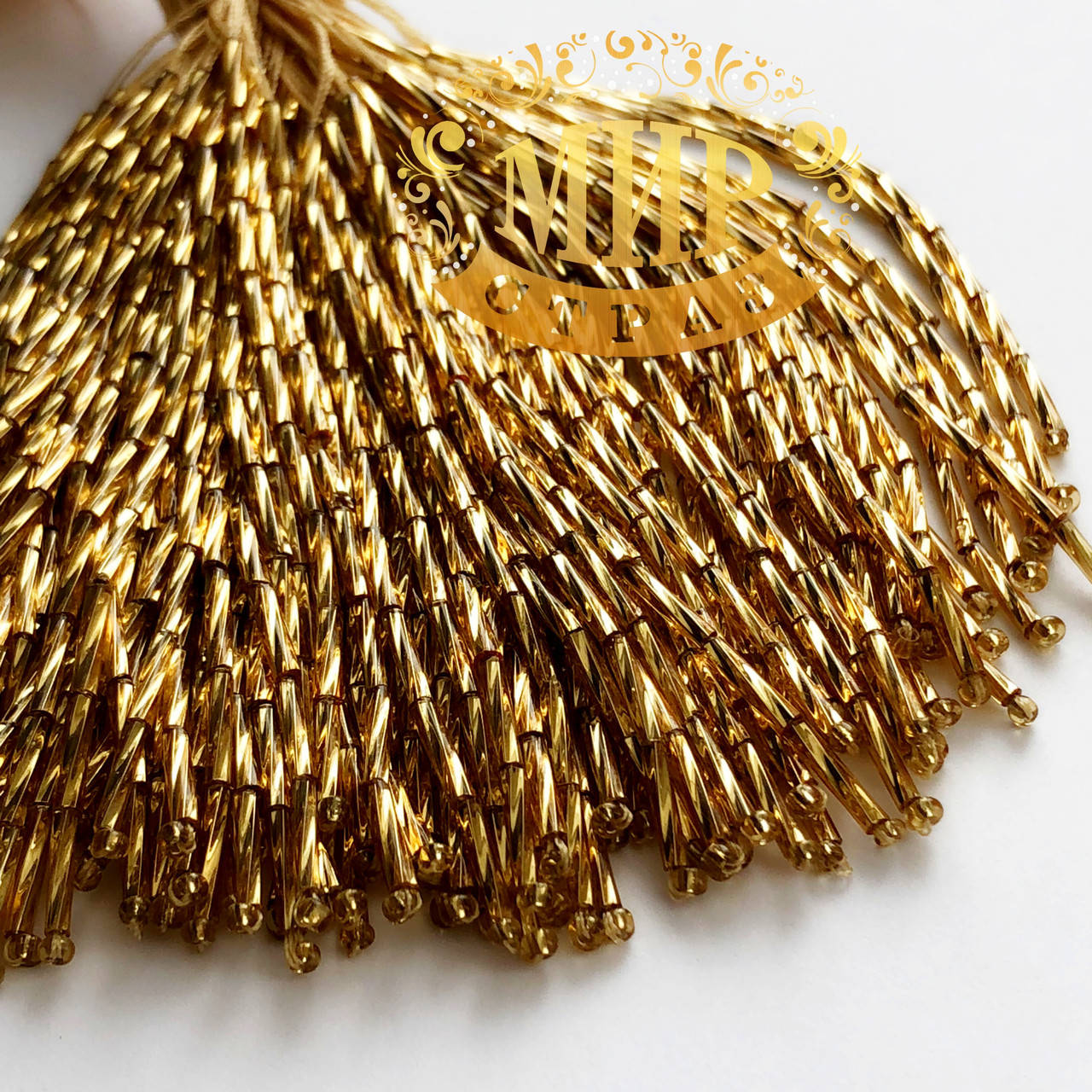 

Стеклярус на нитях витой, цвет Gold, длинна 8см (10штук)