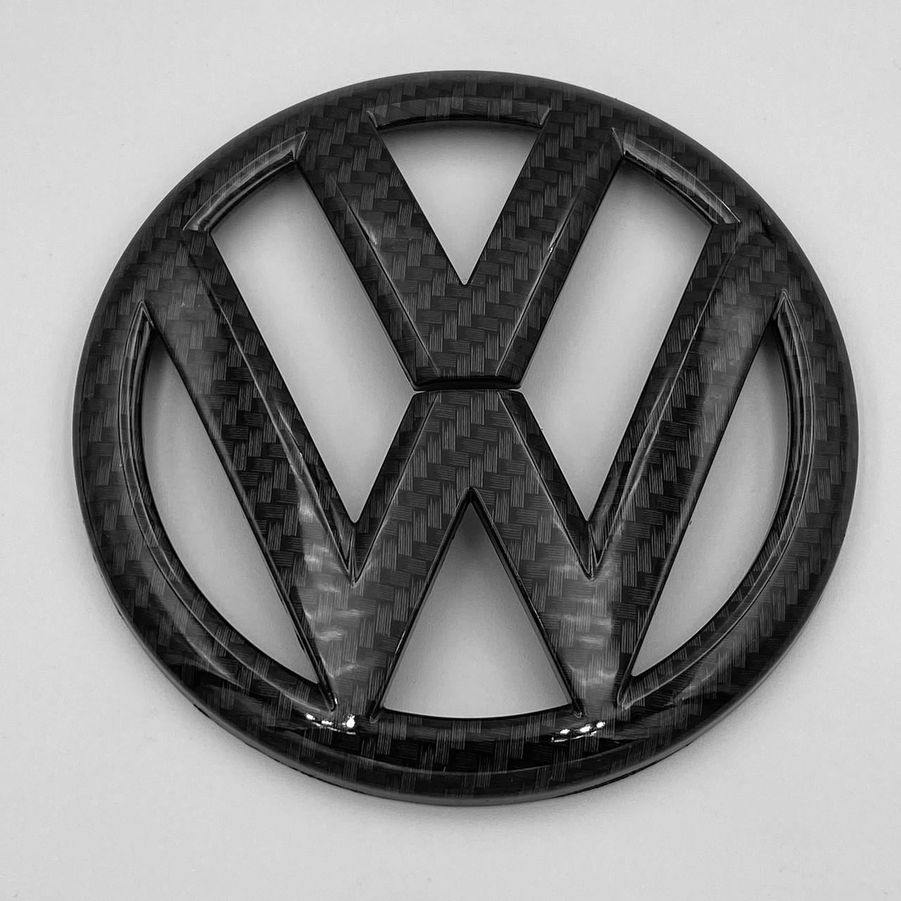 

Эмблема перед, значок решетки радиатора VW (Фольцваген) 137 мм GOLF 7 Черный Карбон