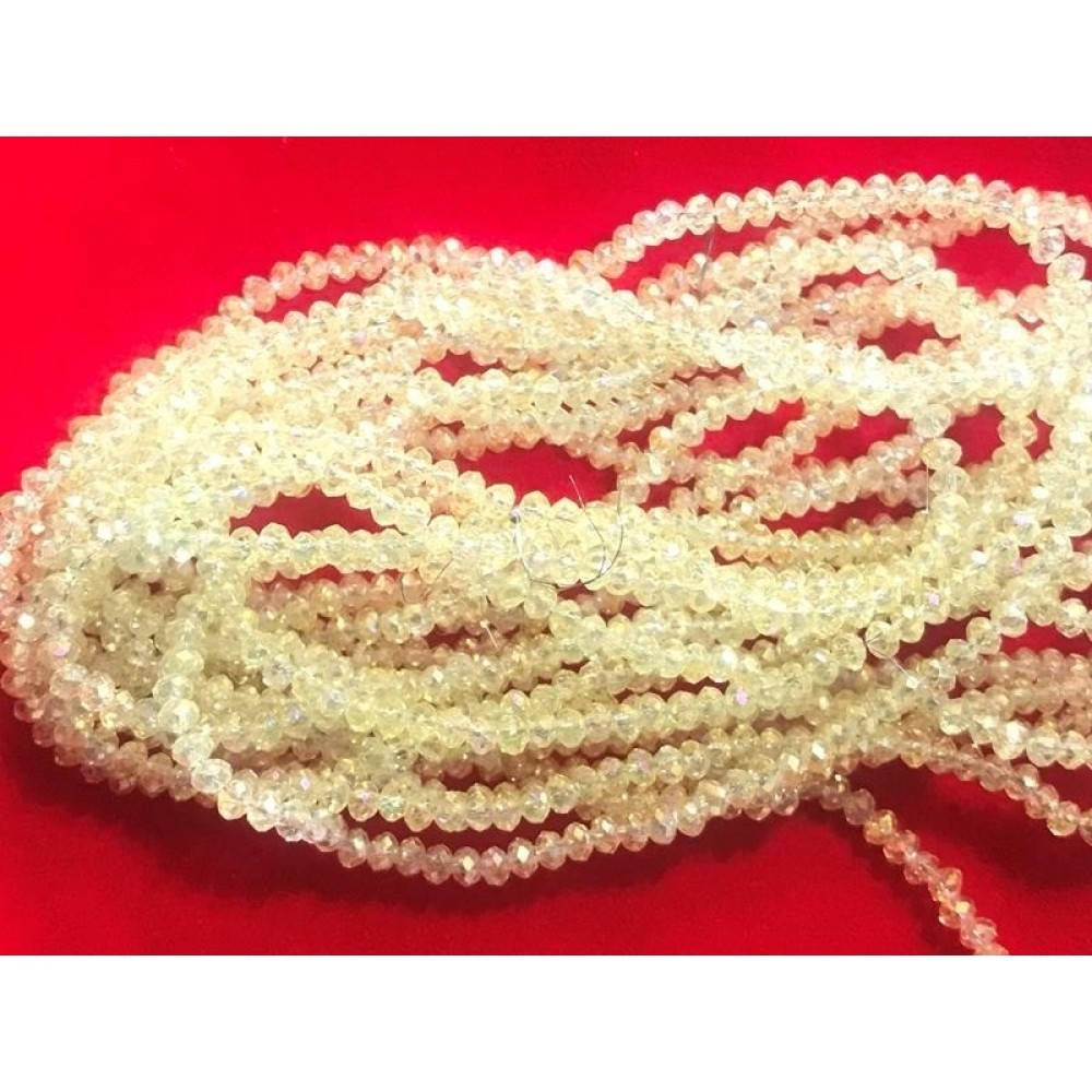 

Хрустальные бусины(рондель). Размер 2 мм. В упаковке прим.190 шт. цвет - лимонный с переливом