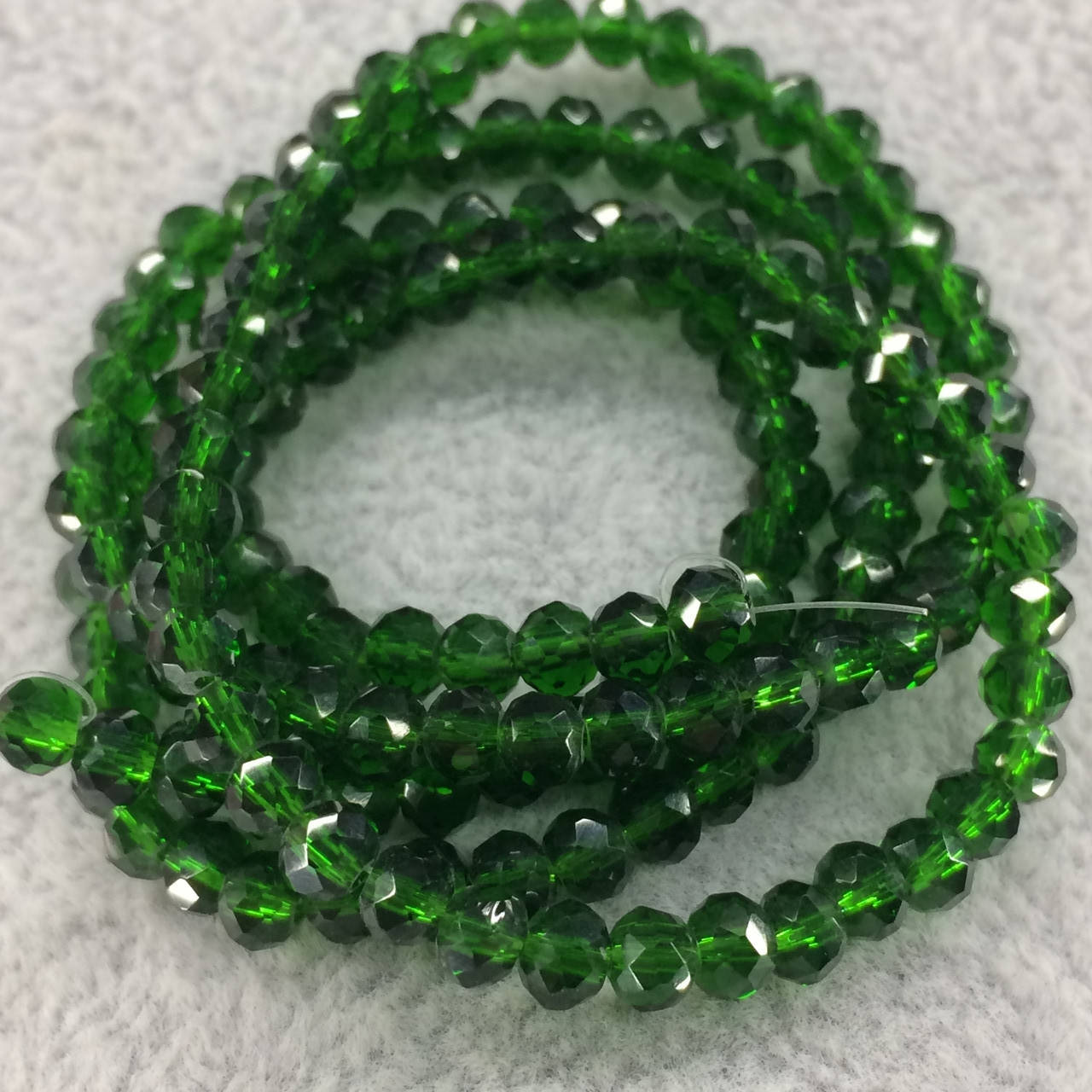 

Бусины на нитке Стекло рондель d=4мм цвет темно-зеленый (~140 бусин на нитке)