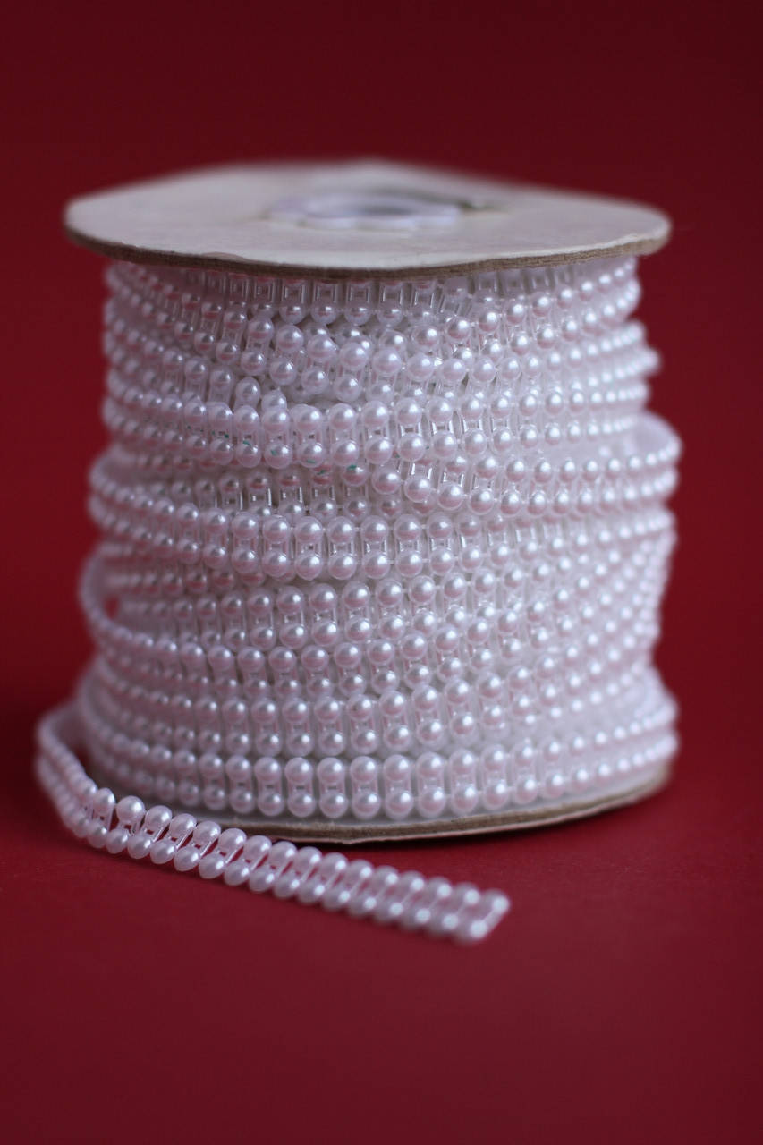 

Тасьма з перлин (подвійних половинок) біла