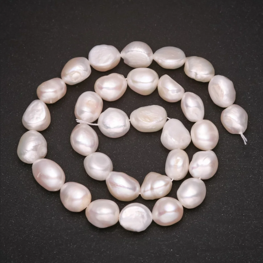 

Бусины жемчуг барочный белый d-12х10(+-)мм L-35см