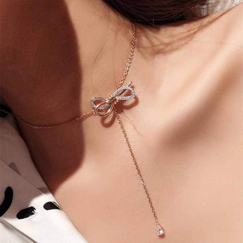 

Золотистий ланцюжок з бантиком та камінцями