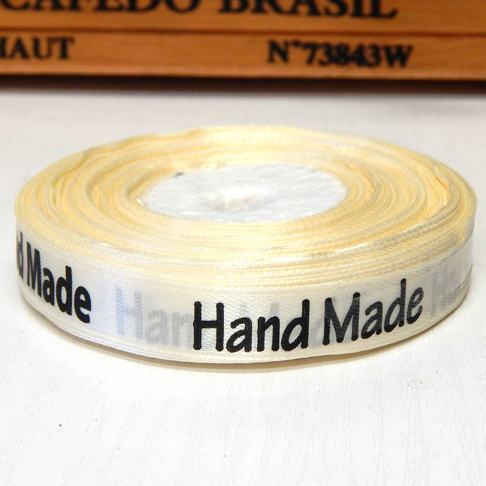 

Атласная лента 1,2 см с надписью Handmade, кремовая