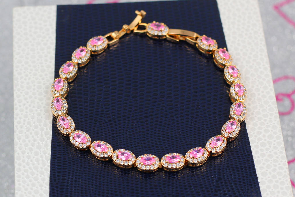 

Браслет Xuping Jewelry с овальными розовыми камнями в кругу белых 17 см 7 мм золотистый