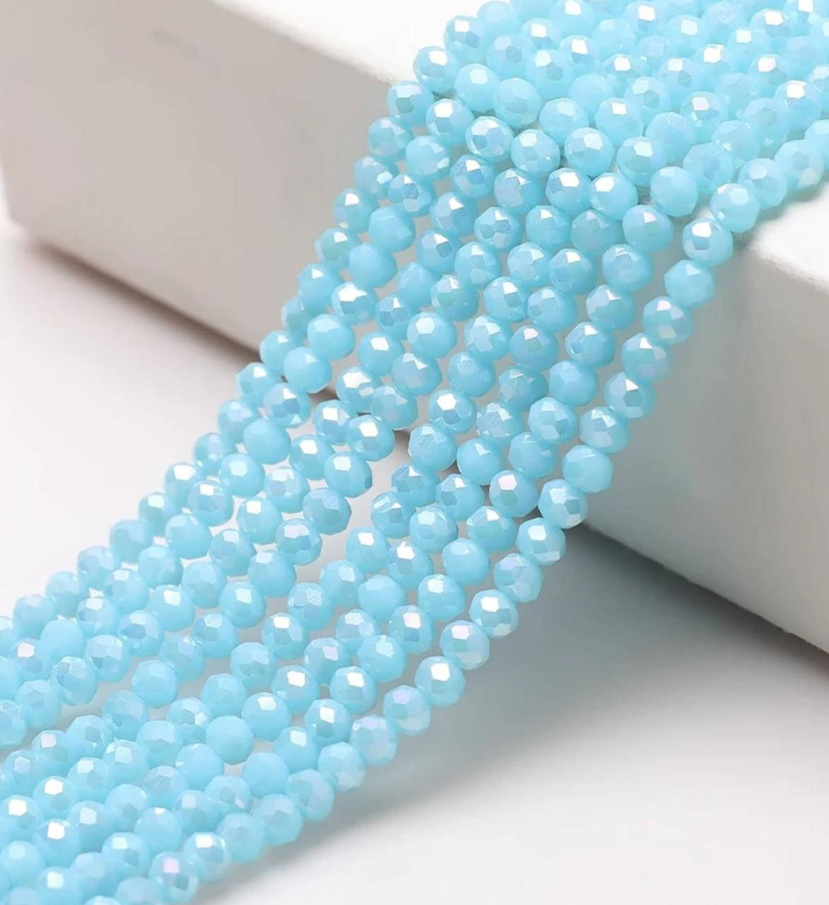 

Бусины хрустальные (Рондель) 4*3 мм пачка 135-140 шт, цвет - голубой матовый с переливом