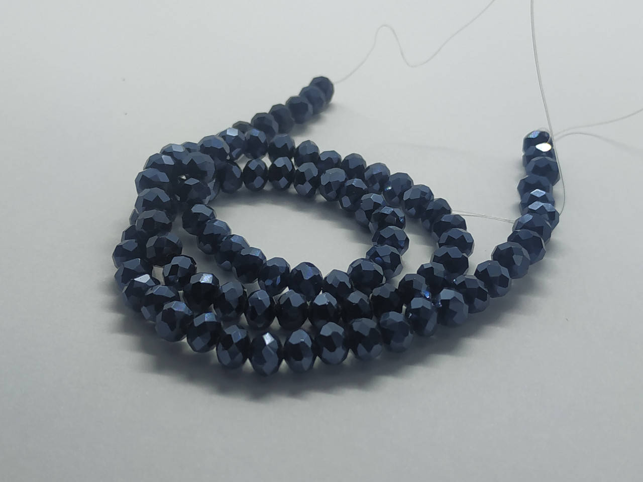 

Хрустальные бусины(стекло). Размер - 6 мм. В упаковке 95-105 шт. Цвет - графитовый