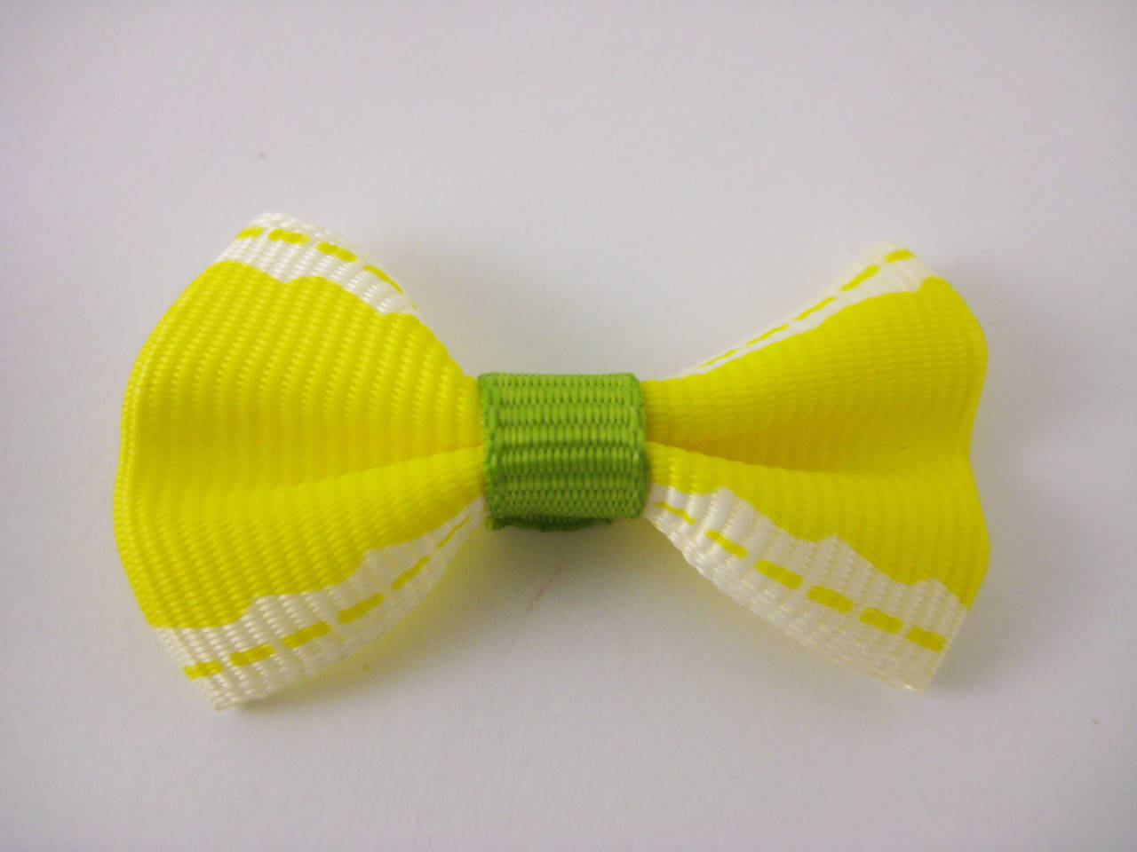 

Бантики. Цвет желтый. 4х2 см
