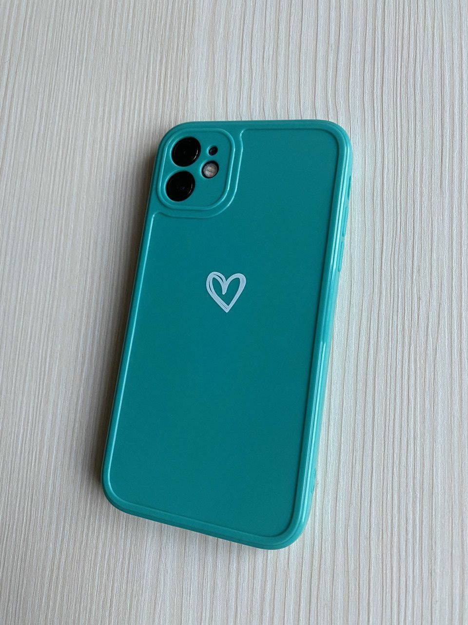 

Силиконовый глянцевый чехол бирюзовый с сердцем iPhone 11