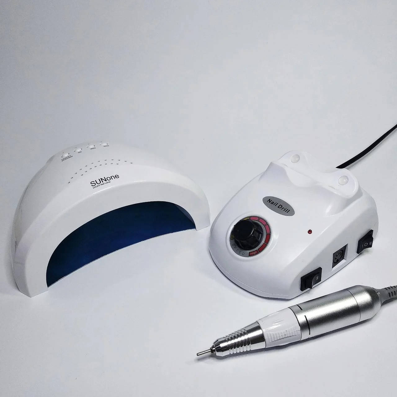 

Стартовый набор для мастера маникюра фрезер Nail Drill Master +лампа SunOne 48Вт