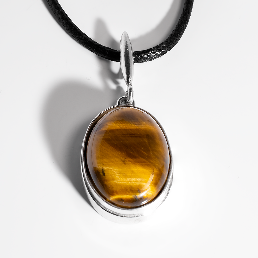 

Серебряный кулон с тигровым глазом, 20*15 мм., 1453КЛТ