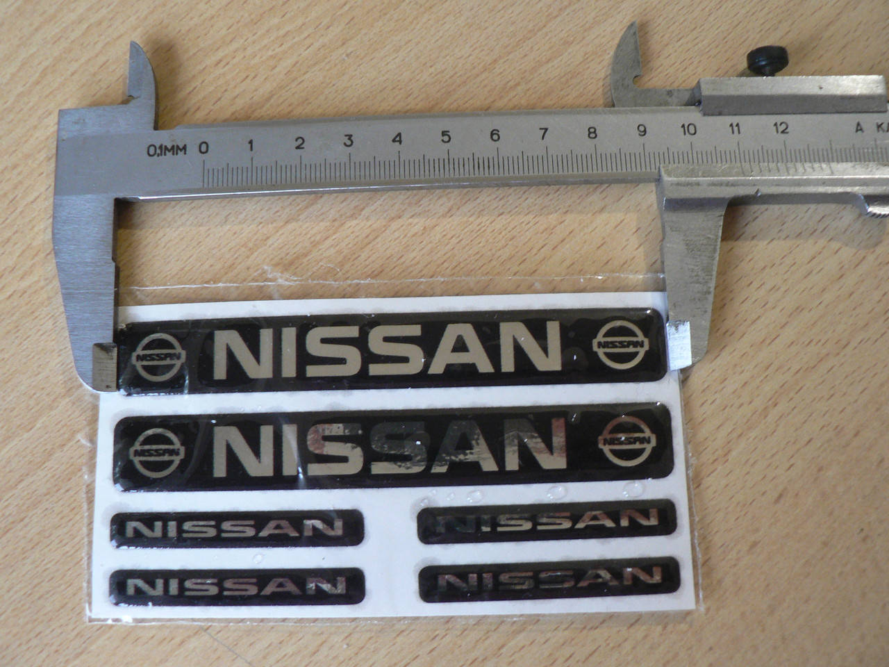 

Наклейка s маленькая Nissan набор 6шт (2шт-11х1,5см и 4шт-5х0,7см) силиконовая надпись на авто эмблема Ниссан