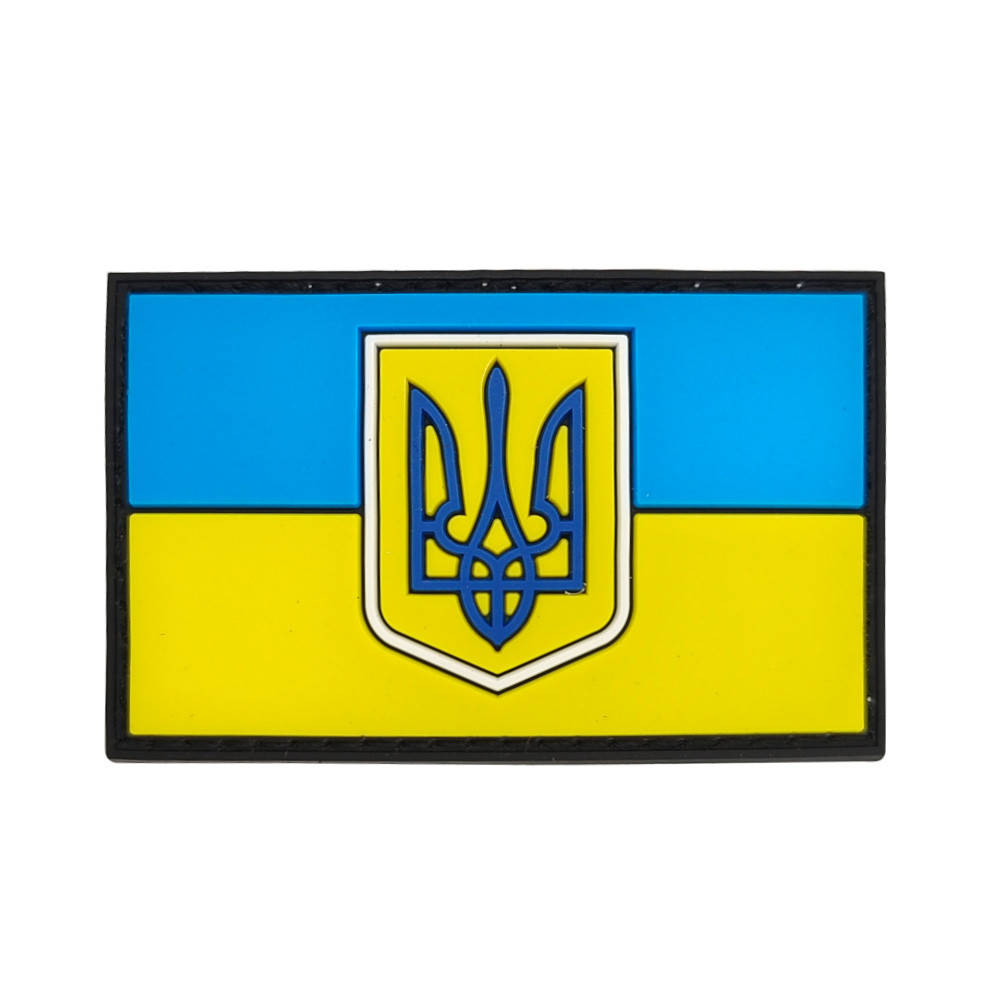 

Шеврон в виде флага Украины с трезубцем резиновый на липучке 4х7 см.