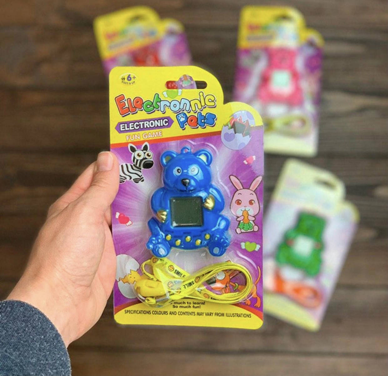 

Іграшка Тамагочі ведмедик 168 персонажів синій, Синий