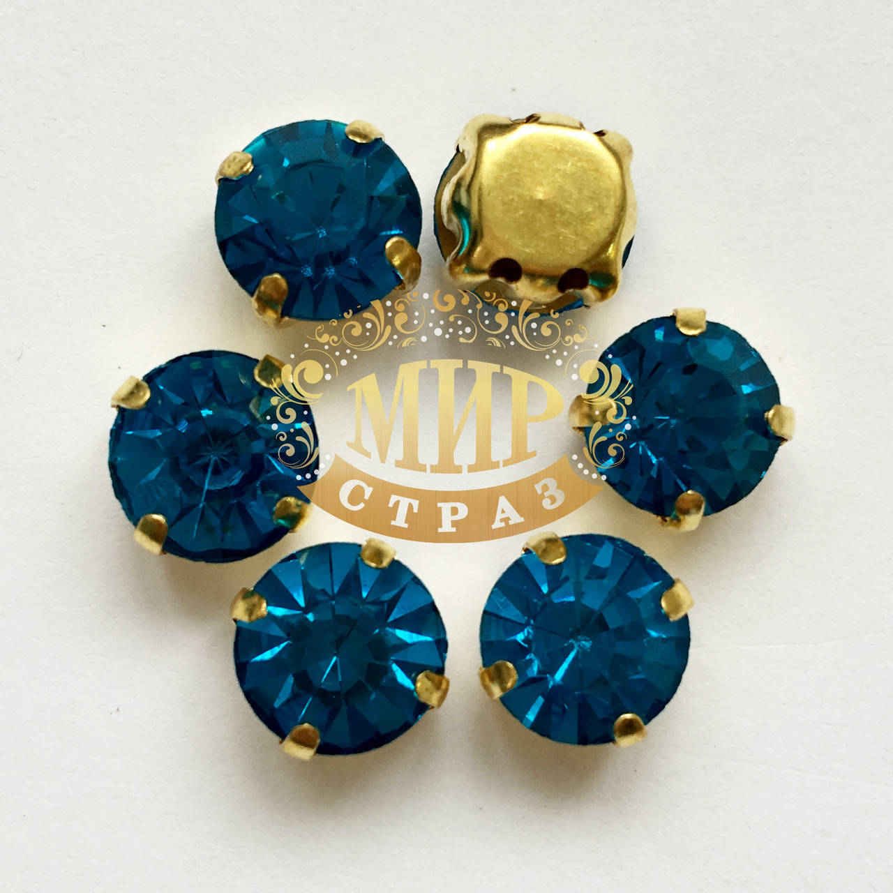 

Шатоны в золотых цапах 8мм Цвет Blue Zircon