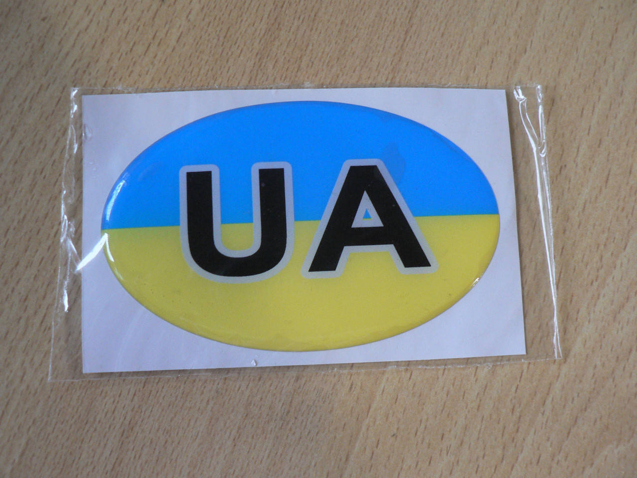 

Наклейка S силиконовая UA Украина 94х60х1.3мм флаг желто синяя овал на авто