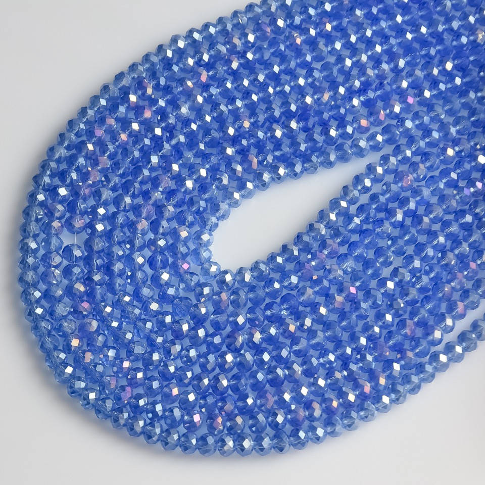 

Бусины стекло прозрачное светло васильковое с напылением "бензин" "рондель" d-6х4мм нитка L-40см