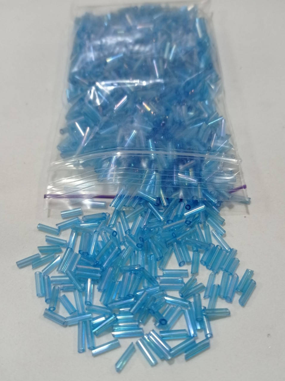

Стеклярус радужный голубой 0,7см 40г