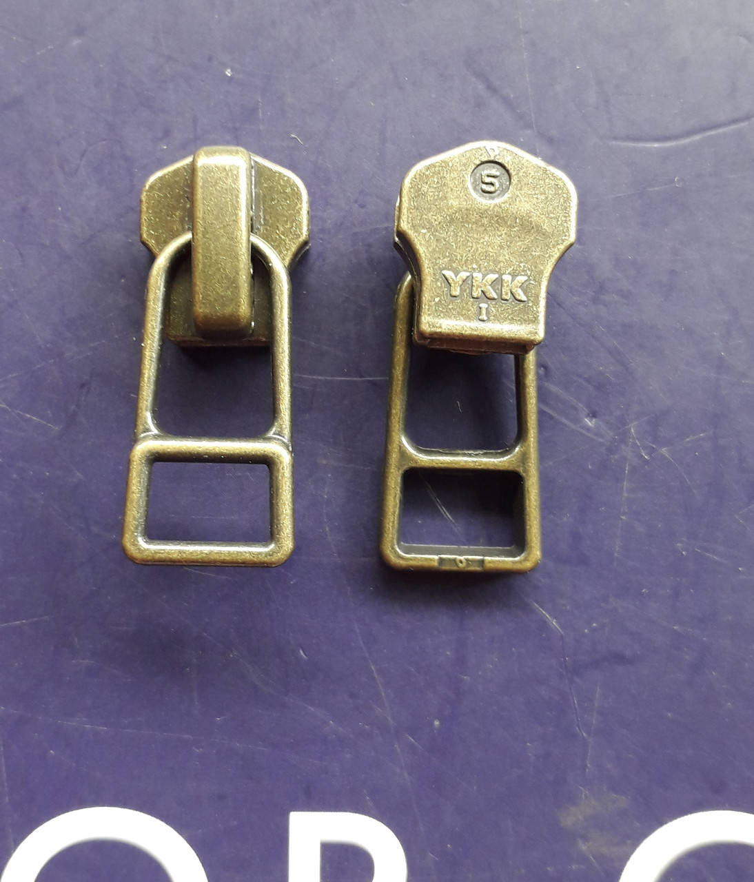 

Бегунки YKK к металлической молнии №5 антик
