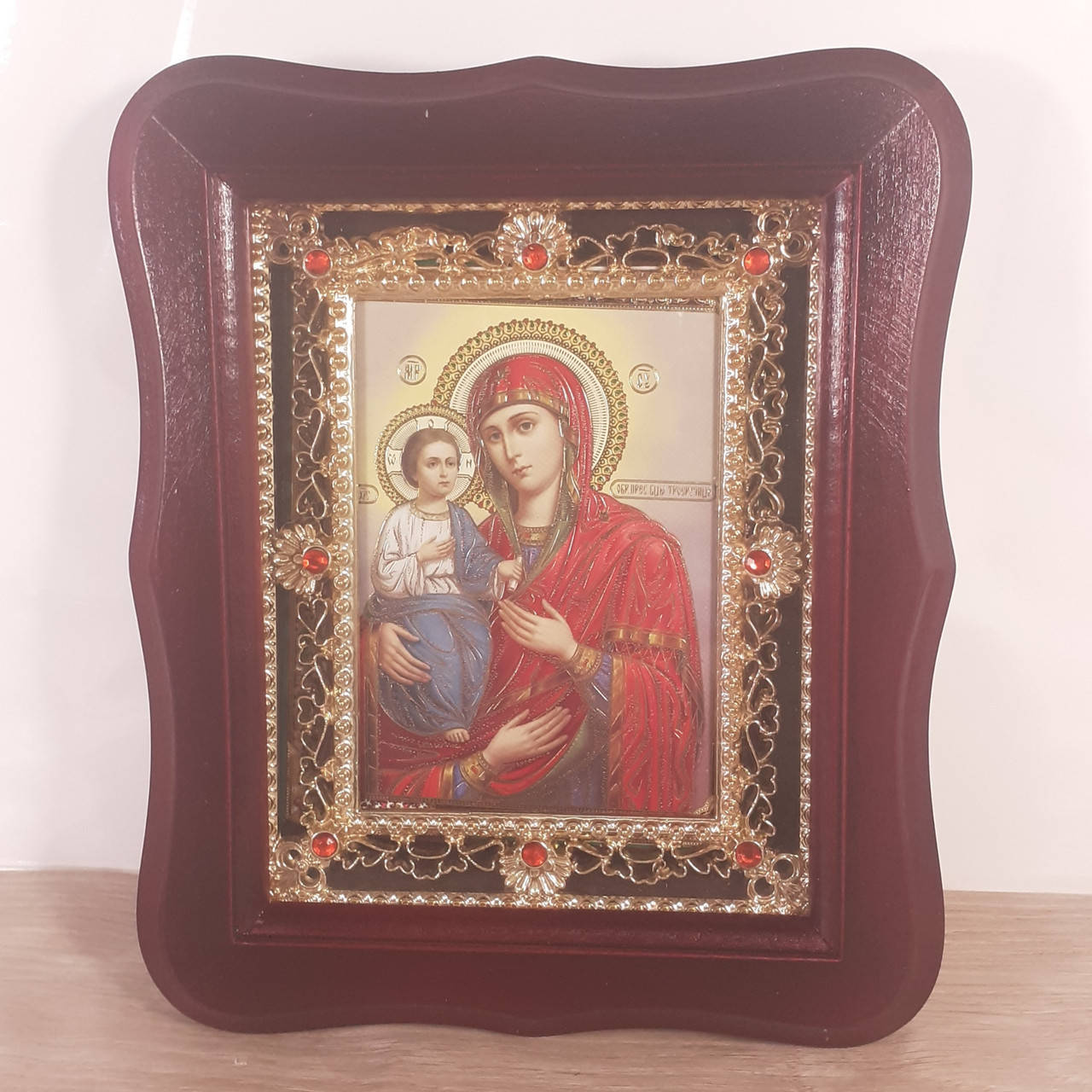 

Икона Пресвятая Богородица Троеручица, лик 10х12 см, в темном деревянном киоте с камнями
