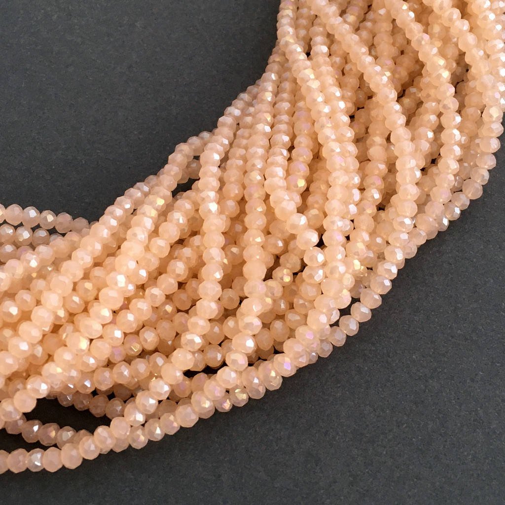 

Рондели 2х3 мм (стекло). Персиковый полупрозрачный с АБ. 180-190 шт.