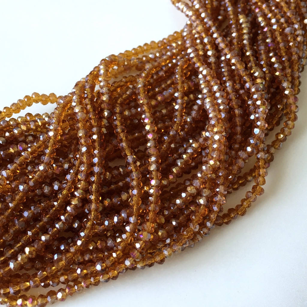 

Рондели 2х3 мм (стекло). Коньячный прозрачный с АБ. 180-190 шт