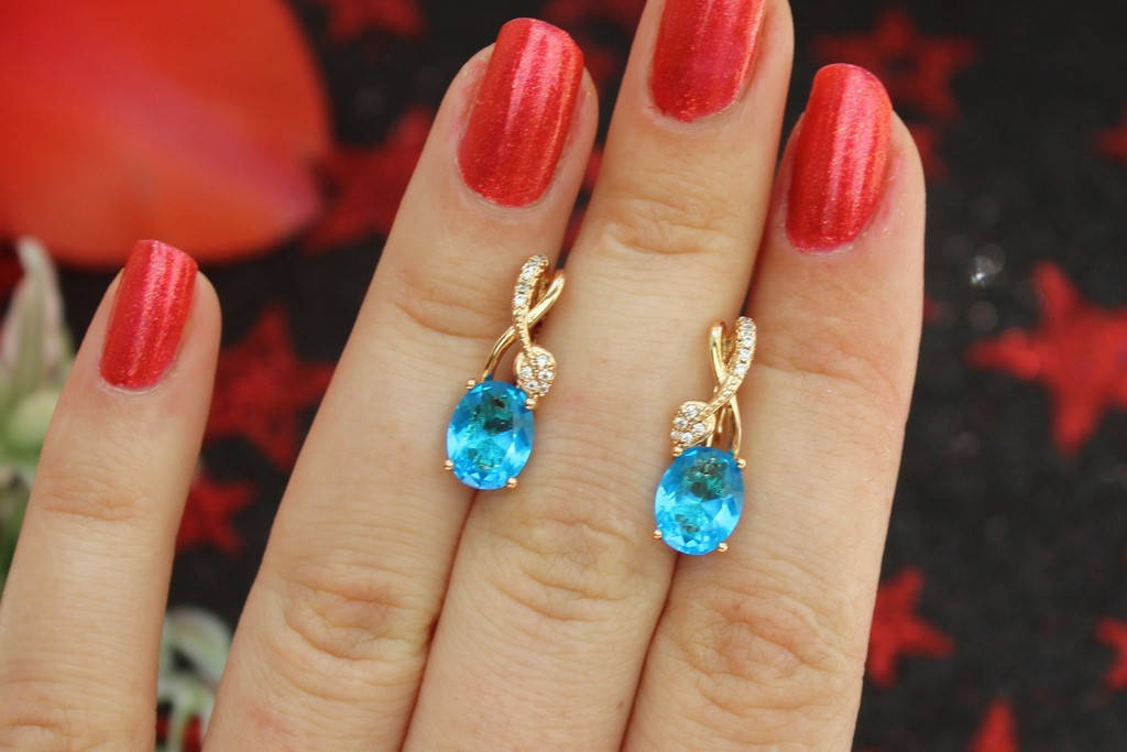 

Серьги Xuping Jewelry с голубым овальным камнем и листиком сверху 2 см золотистые