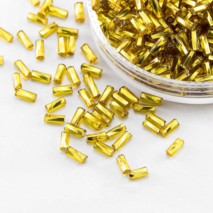 

Бисер Preciosa Стеклярус 2 Прозрачный с Серебряной Полосой TSL Цвет: 87010 Желтый 50г