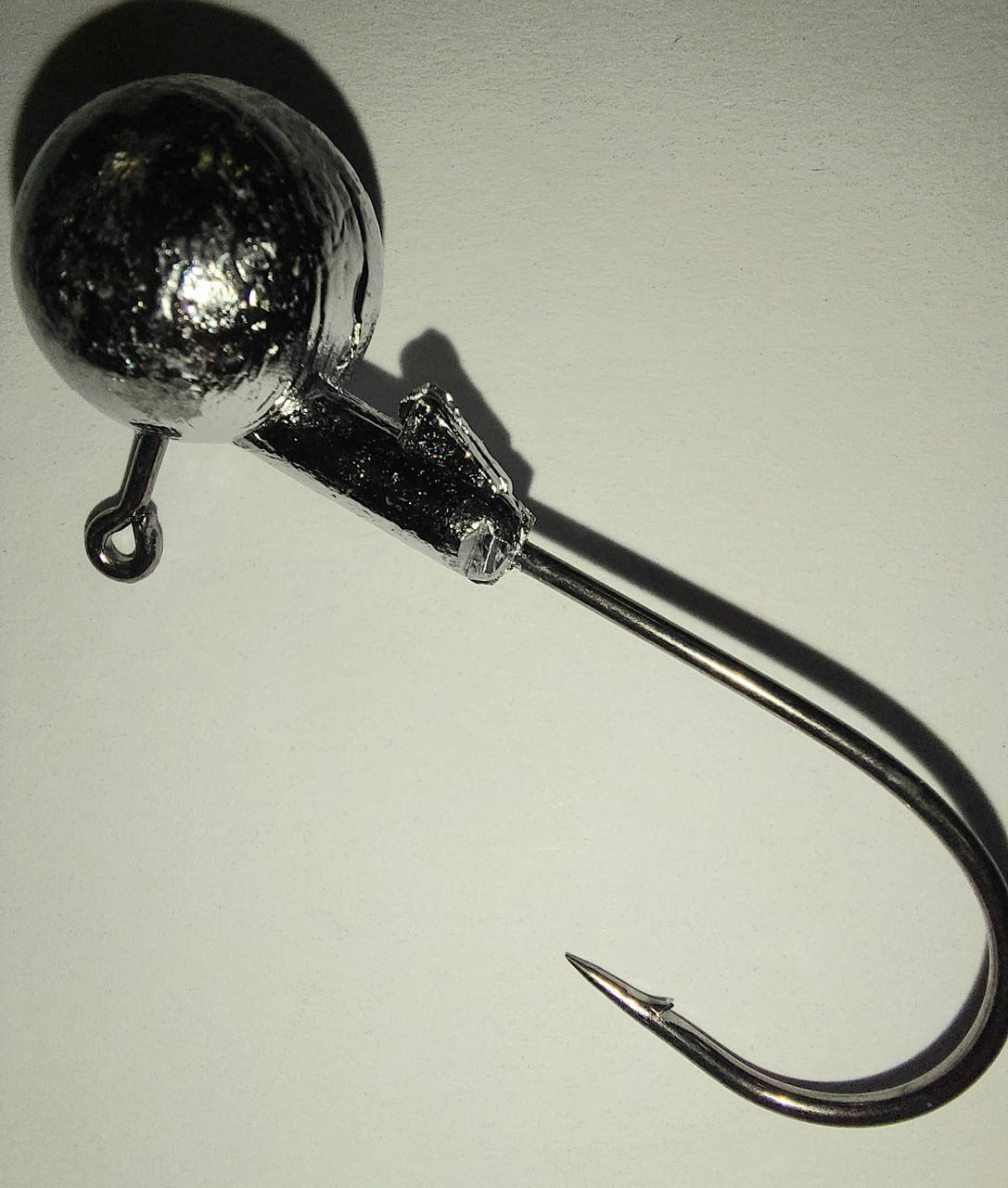 

Джиг-головка 20 г на крючке Mustad 4/0