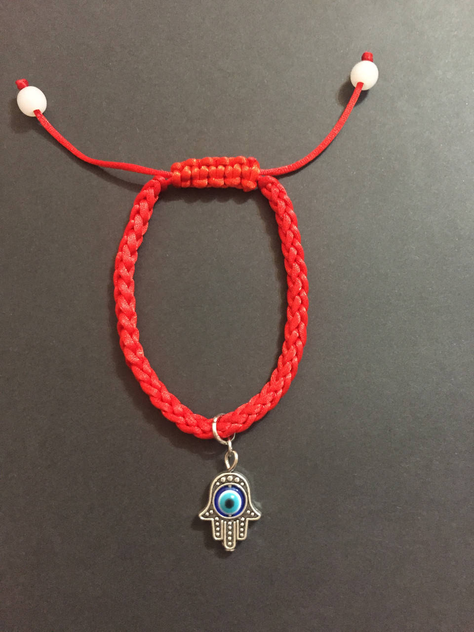

Браслет красная нить оберег от сглаза с талисманом Рука Фатимы